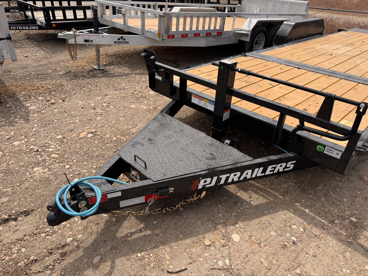 P.J. Trailers 2027 T6 22' Equipment Tilt Trailer | Tandem Axle 14K, Lid Over Tongue, Fork Holders