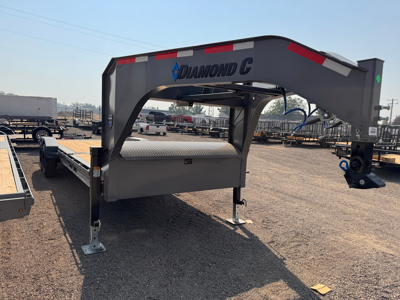 Diamond C Trailers 2026 HDT210 24' Tilt Trailer | Tandem Axle 23K, Engineered I-Beam, Dual Jacks, Full Width Storage, Steel Diamond Plate Fenders, Spare Tire Mount
