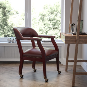 Oxblood Vinyl Luxurious Conference Chair with Accent Nail Trim and Casters Oxblood Vinyl Luxurious Conference Chair with Accent Nail Trim and Casters