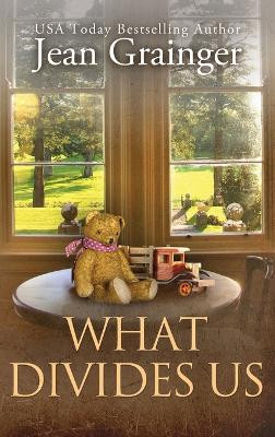 What Divides Us: The Kilteegan Bridge Story - Book 2 by Jean Grainger 9781914958984