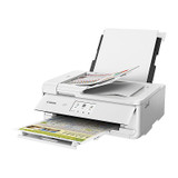 Canon TS9565a printer with open lid and paper tray extended, printing colorful documents.