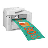 Brother MFCJ6959DW Inkjet MFC printer with large green promotional banner emerging from output tray.