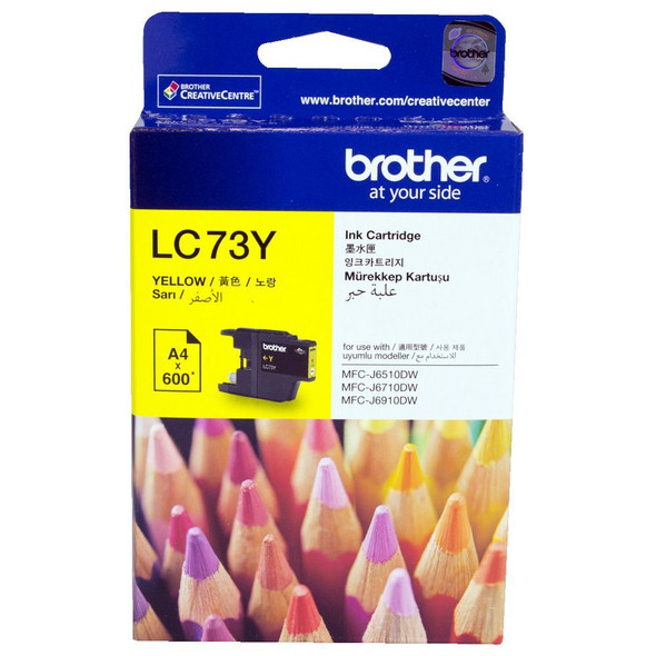 Brother LC73 Yellow Ink Cartridge, genuine Brother product packaging with vibrant colored pencils background visible.