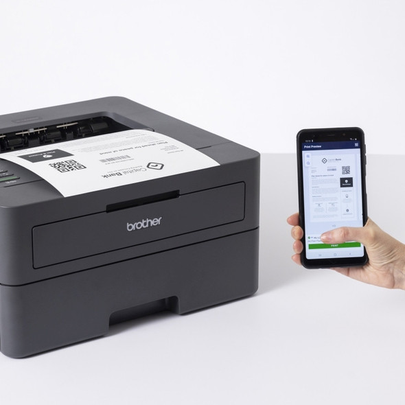 Brother HL-L2445DW Laser Printer with smartphone displaying mobile print app and TN-2530 toner cartridge.