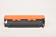 Compatible HP 131X Black Toner Cartridge, orange top and black body, compatible with HP Color LaserJet CP1215, Canon imageCLASS MF8050cn, and more.