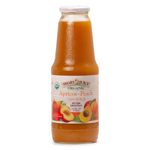 A bottle of Smart Juice Apricot Peach juice blend, bright orange colored juice in a tall glass 1 liter bottle, shown against white background. A bottle of Smart Juice Apricot Peach juice blend, bright orange colored juice in a tall glass 1 liter bottle, shown against white background.