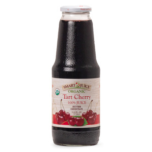 A bottle of Smart Juice organic Tart Cherry juice, dark colored juice in a tall glass 1 liter bottle, shown against white background. A bottle of Smart Juice organic Tart Cherry juice, dark colored juice in a tall glass 1 liter bottle, shown against white background.