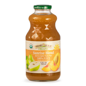 A bottle of Smart Juice organic Sunrise Blend juice, brightly orange juice in a glass 32 fluid ounce bottle, shown against white background. A bottle of Smart Juice organic Sunrise Blend juice, brightly orange juice in a glass 32 fluid ounce bottle, shown against white background.
