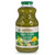 A bottle of Smart Juice organic Super Greens juice, vibrantly green juice in a 32 fluid oz glass bottle, shown against white background.