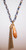 P-48 golden crystal and tassel on braided cord necklace