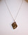 P-119 tan crystal pendant