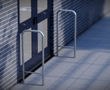 BOYCO Stainless Steel Door Barrier with Standard Catch, featuring a high-polished 316-grade stainless steel frame and integrated automatic door catch, designed to protect doors from wind damage and misuse.