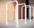 Sheffield cycle stand with base plates, powder-coated in white, featuring a durable tubular steel frame for secure bike parking.