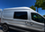 Ford Transit awning window, premium van window, VWD awning window, Transit van ventilation, van window with shade, retractable bug screen, solar privacy glass, secure van window, high-roof Transit window, passenger side awning window, urethane bonded window, van conversion window, privacy van window, minimal frame van window, Ford Transit window upgrade, easy install van window, weatherproof van window, UV protection van window, bug screen van window, insulated van window.- Exterior