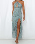 Perfect for beachside lounging and bar hopping, this stylish maxi features a thigh high slit to shoe off those pins!