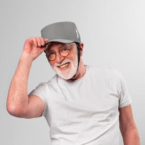 PICTURE OF A MAN WEARING A GREY PROTECTIVE HAT WITH A VISOR AND CHIN STRAP