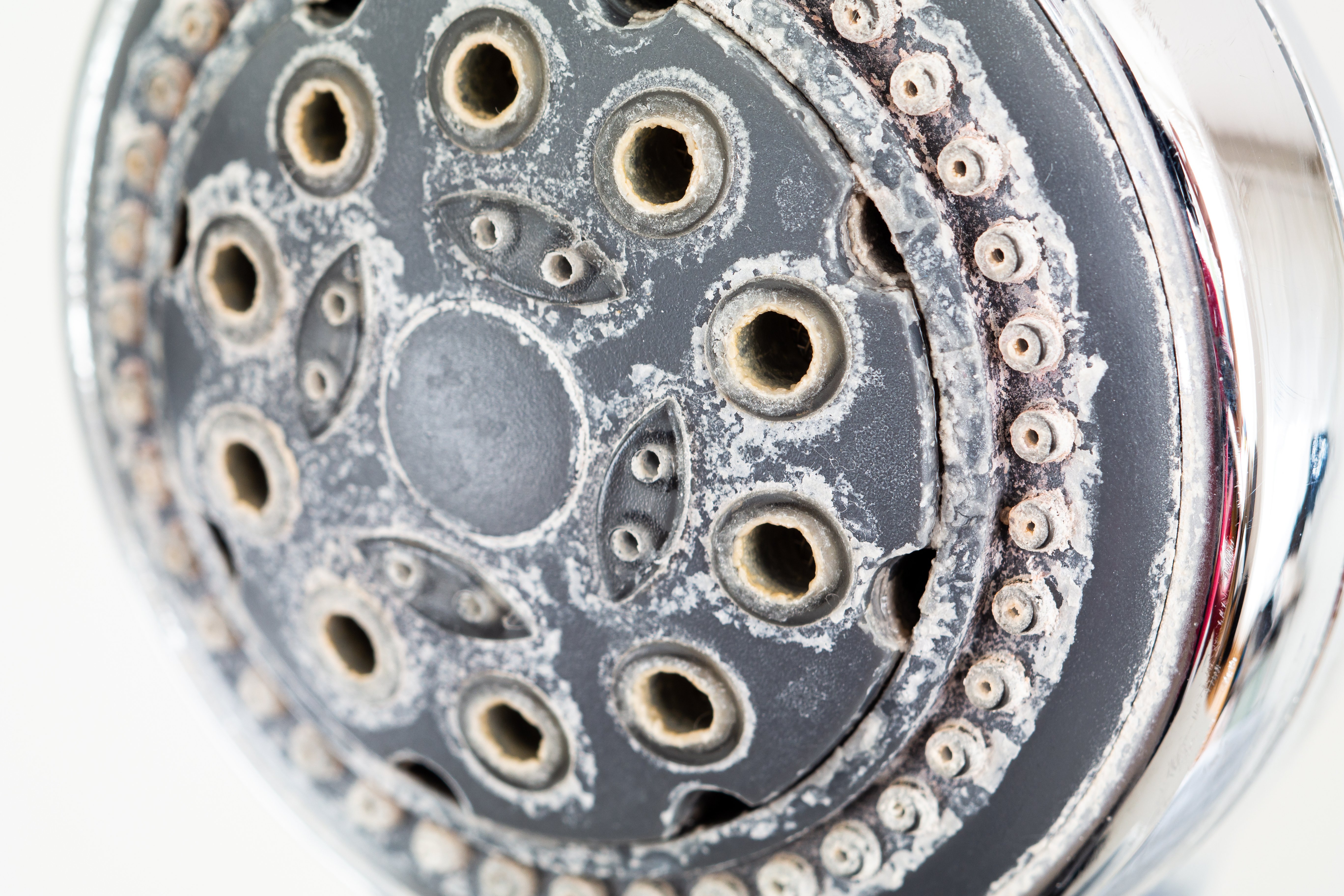 bidet nozzle clogged mineral buildup close up