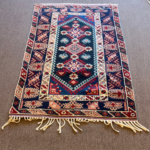 3’11” x 6’0” vintage handknotted Kazak in navy blue, red and ivory color