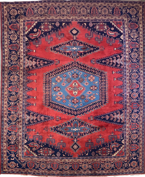 8’8 x 11’2 Semi-Antique, bright red and navy handknotted Heriz carpet