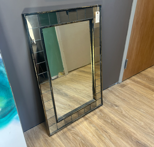 Contemporary gold/black tile mirror.