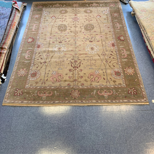 9’11” x 12’10” light brown, olive green and pink traditional oushak style handmade wool carpet from India