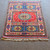 4’10 x 7’1 vintage red, blue and ivory sculpted handknotted Kazak carpet