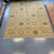 10’ x 12’8 beige, brown, and green traditional geometric rug