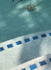 River Rok Serene Seas pebble pool finish creating a beautiful blue water appearance in a remodeled swimming pool