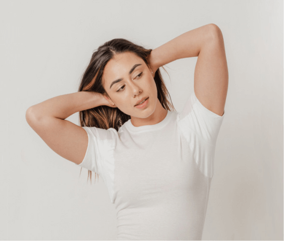 Woman wearing white crewneck Thompson Tee