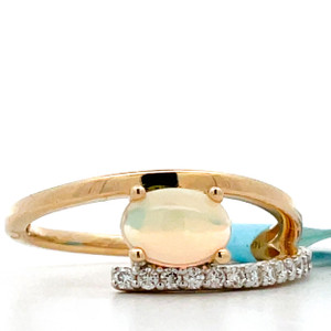 14K Gold Oval cut .56 ct Ethiopian Opal and AP .15 ct Diamond Accents Size 7 14K Gold Oval cut .56 ct Ethiopian Opal and AP .15 ct Diamond Accents Size 7