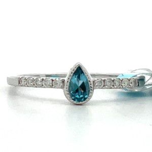 14K White Gold Pear cut .20 ct Blue Topaz and AP .09 ct Diamond Accents Size 7 14K White Gold Pear cut .20 ct Blue Topaz and AP .09 ct Diamond Accents Size 7