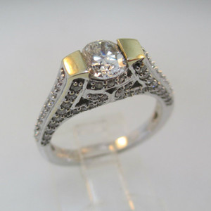 18k White Gold Approx 1.17ct TW Round Brilliant Cut Diamond with Accent Diamonds Surrounding Mount. Size 6 ½ *