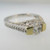18k White Gold Approx 1.17ct TW Round Brilliant Cut Diamond with Accent Diamonds Surrounding Mount. Size 6 ½ *