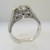 18k White Gold Approx 1.17ct TW Round Brilliant Cut Diamond with Accent Diamonds Surrounding Mount. Size 6 ½ *