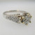 18k White Gold Approx 1.07ct TW Round Brilliant Cut Diamond with Accent Diamonds Surrounding Mount. Size 6 ¼