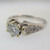 18k White Gold Approx 1.07ct TW Round Brilliant Cut Diamond with Accent Diamonds Surrounding Mount. Size 6 ¼