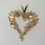 14k Yellow Gold Approx .50ct TW Round Brilliant and Emerald Cut Diamond Heart Shaped Pendant