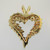 14k Yellow Gold Approx .50ct TW Round Brilliant and Emerald Cut Diamond Heart Shaped Pendant