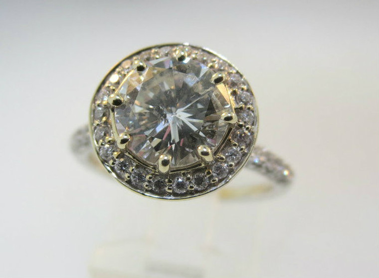 18k White Gold Approx. 1.41ct Round Brilliant Diamond Halo Ring Surrounded with Diamonds and Yellow Gold Accents. Size 6 ½ *