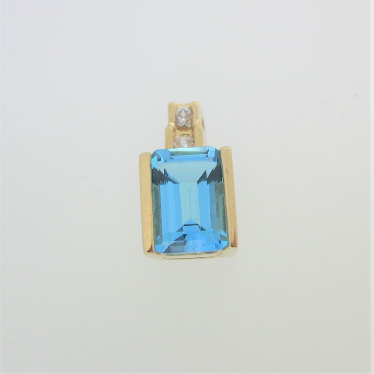 10k Yellow Gold Emerald Cut Blue Topaz Pendant with CZ Accents