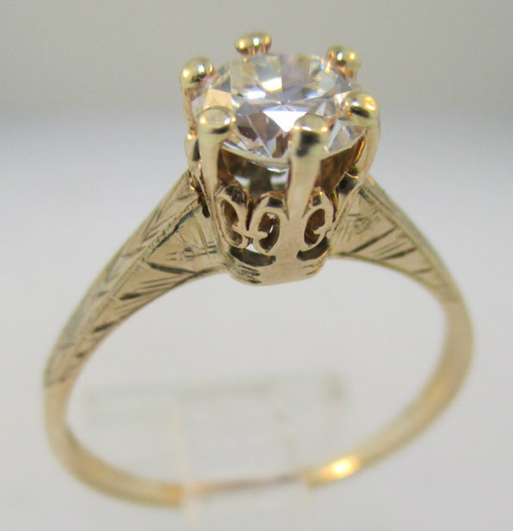 Vintage 1910- 1920’s. 10k Yellow Gold with a Rose Gold Tint Solitaire Approx. .83ct European Cut Diamond with Filigree Accents Surrounding Ring. Size 7 ¼ *