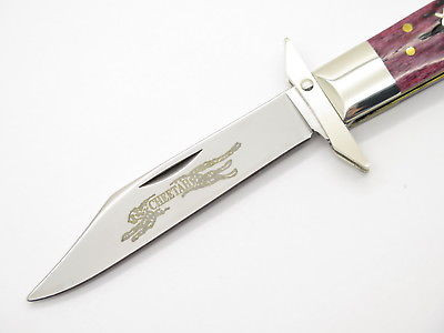 2002 Case XX 6111 1/2 Cheetah Script Cranberry Swing Guard Folding