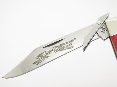 2003 Case XX 6111 1/2 Red Bone Cheetah Swing Guard Folding Pocket