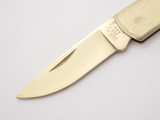 1997 Unusual Buck 425 Gold Tone Stainless Lockback Folding Pocket Knife
