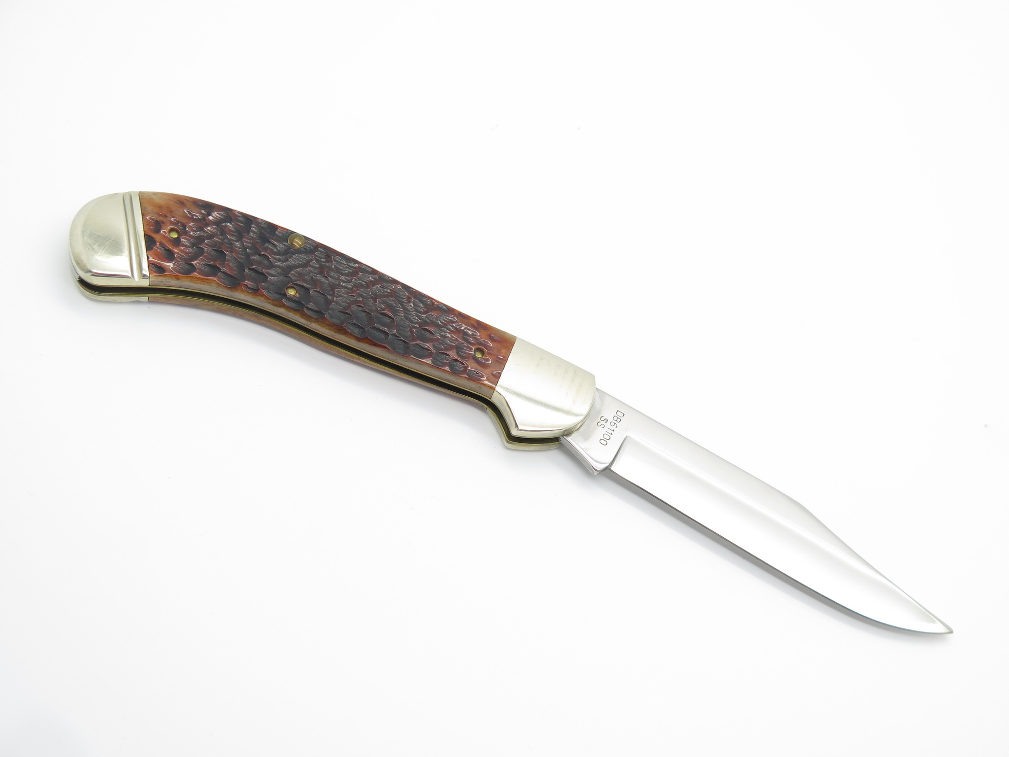 1991 Case XX NKCA 61100 Saddlehorn Jigged Brown Bone Folding