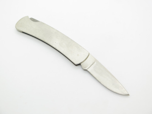 Vintage 1992 Buck 525 Raccoon Stainless Handle Folding Lockback Pocket Knife