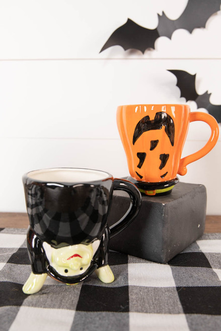 Two Halloween Handstand Mugs