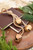 18" Gold Iron Jingle Bells & Jute Rope Ornament- Detail on Tray