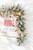 9' x 12" Classic Flocked Garland with LED Lights - Styled on Sign