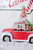 11.5” B/O Lighted Water Globe Red Truck with Gingerbread Family OFF